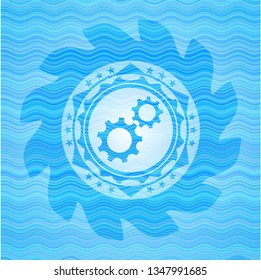 gear, team work icon inside water wave badge background.