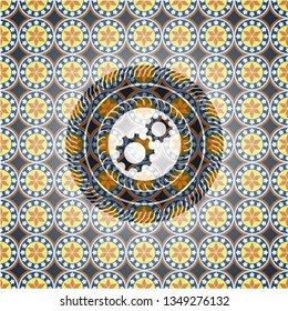 gear, team work icon inside arabesque emblem. arabic decoration.