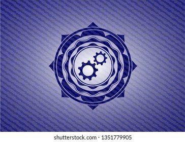 gear, team work icon inside badge with jean texture
