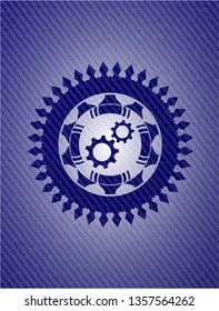 gear, team work icon inside badge with jean texture