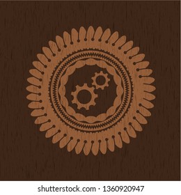 gear, team work icon inside wood emblem