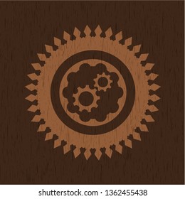 gear, team work icon inside badge with wood background