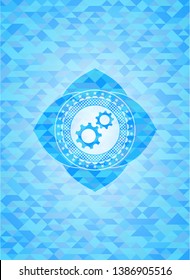 gear, team work icon inside light blue emblem with triangle mosaic background
