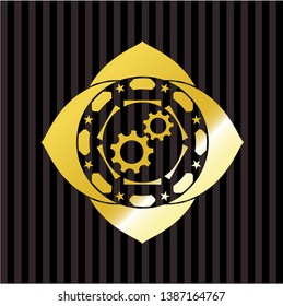 gear, team work icon inside gold emblem or badge