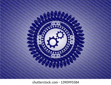gear, team work icon inside badge with jean texture