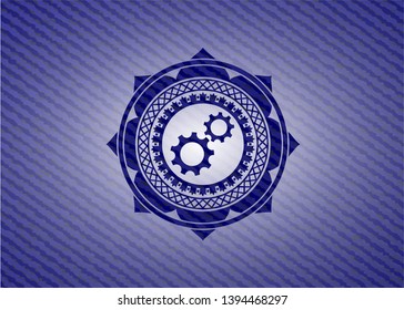 gear, team work icon inside emblem with jean background