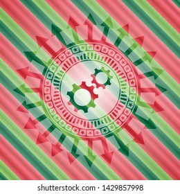 gear, team work icon inside christmas colors badge.