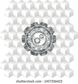 gear, team work icon inside grey emblem with geometric cube white background