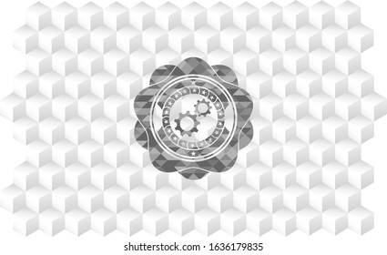 gear, team work icon inside grey badge with geometric cube white background