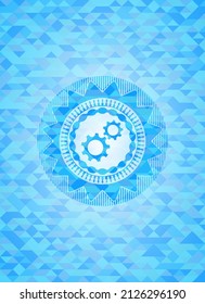 gear, team work icon inside sky blue mosaic emblem. 