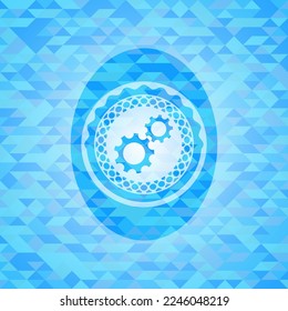 gear, team work icon inside light blue emblem with mosaic ecological style background. 