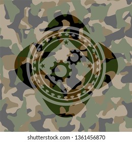 gear, team work icon on camouflaged pattern