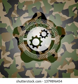 gear, team work icon on camouflage pattern