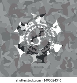 gear, team work icon on grey camouflaged pattern