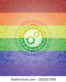 gear, team work icon on mosaic background with the colors of the LGBT flag