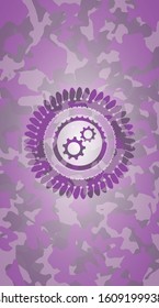 gear, team work icon on pink and purple camo texture