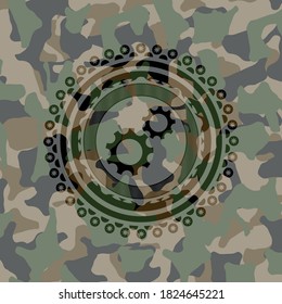 gear, team work icon on camo pattern. 