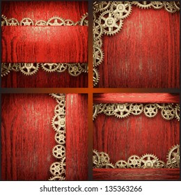 gear wheels on red wood background