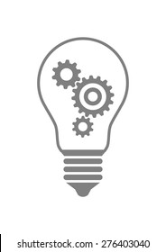 Gears in lightbulb on white background 