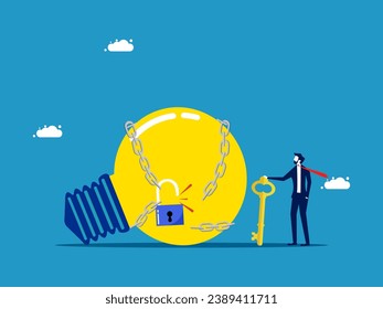 Generating business ideas. Businessman uses a key to unlock a light bulb from a chain