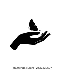 Gentle hand holding a delicate butterfly silhouette.