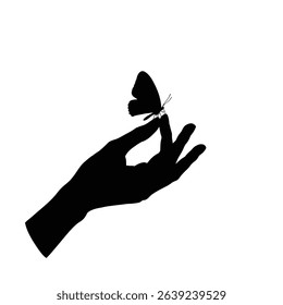 Gentle hand holding a delicate butterfly silhouette.