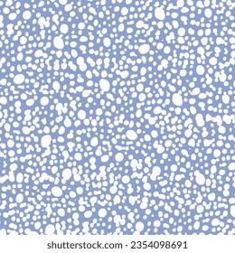Gentle seamless shagreen texture of white blots and droplets on pastel blue background; light grainy vector surface design