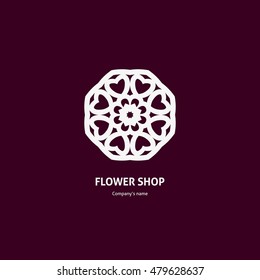 Gentle white logo on a dark background for boutique, flower shop, business, interior. Company mark, emblem, element. Simple geometric mandala logotype. Kaleidoscope big bud. Surround abstract blossom.