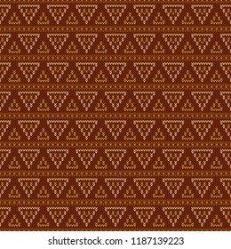 Geometric abstract knitted pattern. Autumn seamless pattern. Design for sweater, scarf, comforter or clothes texture. Vector illustration.