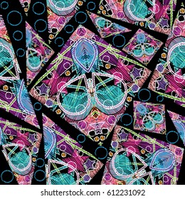 Geometric abstract seamless pattern. Black vector background with colorful geometrical figures, lines, shapes, squares, rhombus,  triangles in embroidery style. Modern texture for prints, fabrics