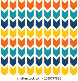 Geometric bohemian arrows seamless pattern in retro colors: teal, blue, yellow, orange.