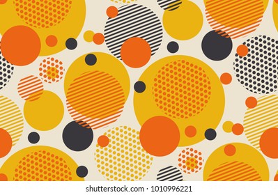 Geometric circle seamless pattern vector illustration in retro 60s style. Vintage 1970s ball shapes abstract motif in hot orange and yellow colors for carpet, wrapping paper, fabric, background.
