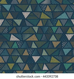 Geometric ethnic multicolored seamless pattern with triangles in vintage colors. Vector