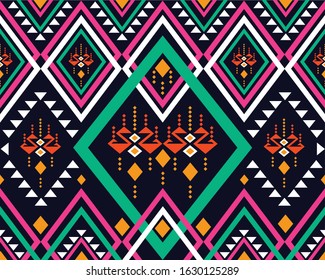 Geometric ethnic pattern multi color design on dark midnight navy background. Pink, green, yellow, white geometry abstract wallpaper for handcraft, carpet, clothing, fabric design.