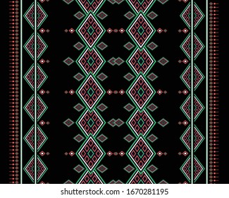 Geometric ethnic pattern oriental design on black background. Traditional geometry abstract with white, orange, green, for wallpaper, handcraft, carpet, clothing, fabric, wrapping. Embroidery style.