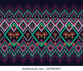 Geometric ethnic pattern traditional multi-color design on dark midnight navy background. Pink, green, yellow, white geometry abstract wallpaper for handcraft, carpet, clothing, fabric design.