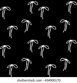 geometric fashion abstract background with delicate white bows on black