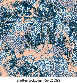 Geometric grunge pattern in bright colors on colorful hand painted background. Bold print with stripes and shapes on paint splatters and splashes. Vintage texture with ethnic and tribal motifs
