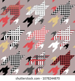 Geometric hounds tooth print. Large scale seamless pattern with checkered elements. Red, black, white on grey background.