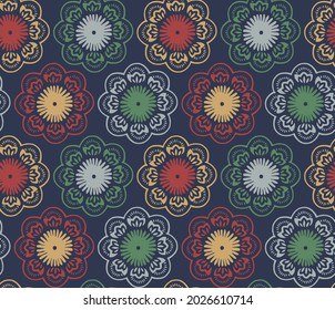 Geometric indian paisley pattern on dark blue background.Geometric seamless pattern circular ornament. Vector multicolor mandalas in red, yellow and green colors.