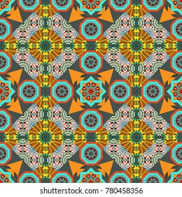 Geometric kaleidoscope mandala. Vector background - symmetric seamless pattern design in orange, gray and blue tones.