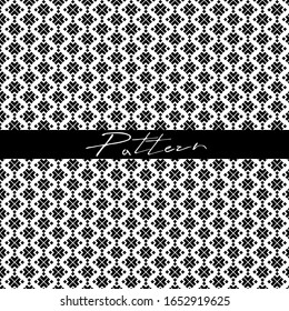 geometric pattern with black elements on a white background