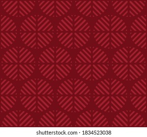 geometric pattern:red striped circles on a burgundy background