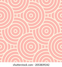 Geometric pink circles with an outline. Seamless pattern for trendy fabrics, decorative pillows, wrapping paper. Vector.