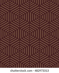 Geometric repeating vector ornament with golden hexagonal dotted elements. Seamless abstract modern pattern