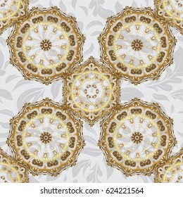 Geometric repeating vector ornament with golden elements. Seamless abstract modern pattern on a gray backdrop. Gray and golden seamless pattern.
