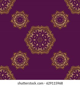 Geometric repeating vector ornament with golden elements. Seamless abstract modern pattern on a purple backdrop. Purple and golden seamless pattern.