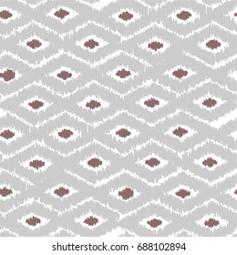 Geometric seamless Ikat abstract pattern with big and small rhombus