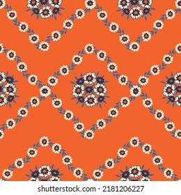 Geometric seamless orange pattern with little flowers. Print for textile, wallpaper, covers, surface. For fashion fabric.