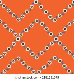 Geometric seamless orange pattern with little flowers. Print for textile, wallpaper, covers, surface. For fashion fabric.
